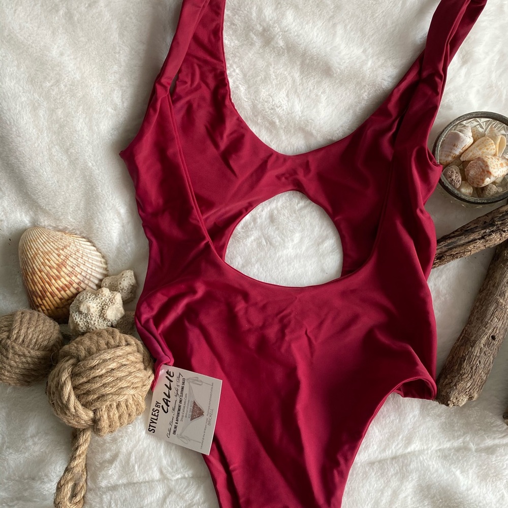 NWT Deep red. Design cut out through front &  back